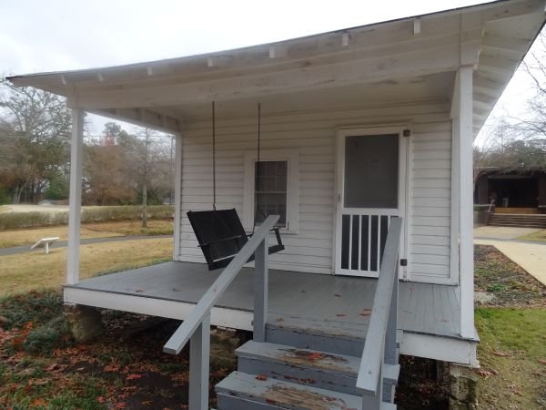 Shotgun house - one that if a bullet is shot through the front door - it would leave through the back door without hitting anything.